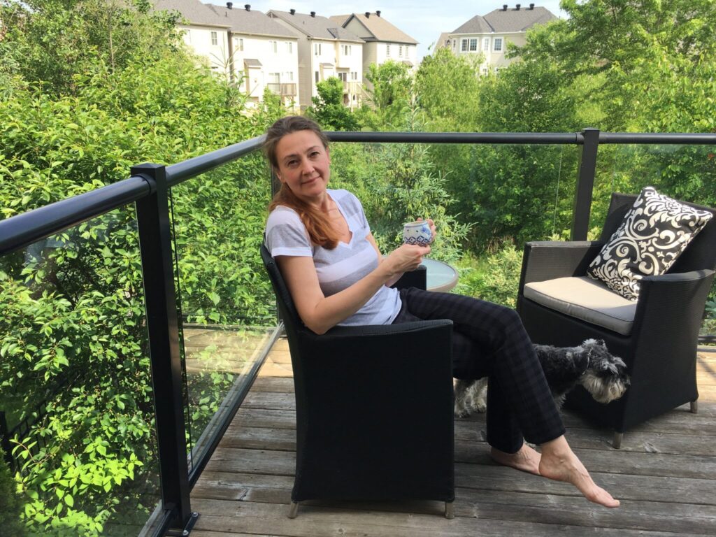 woman-sitting-with-cup-of-coffee-on-summer-day-out-2025-01-08-02-34-14-utc-2048x1536